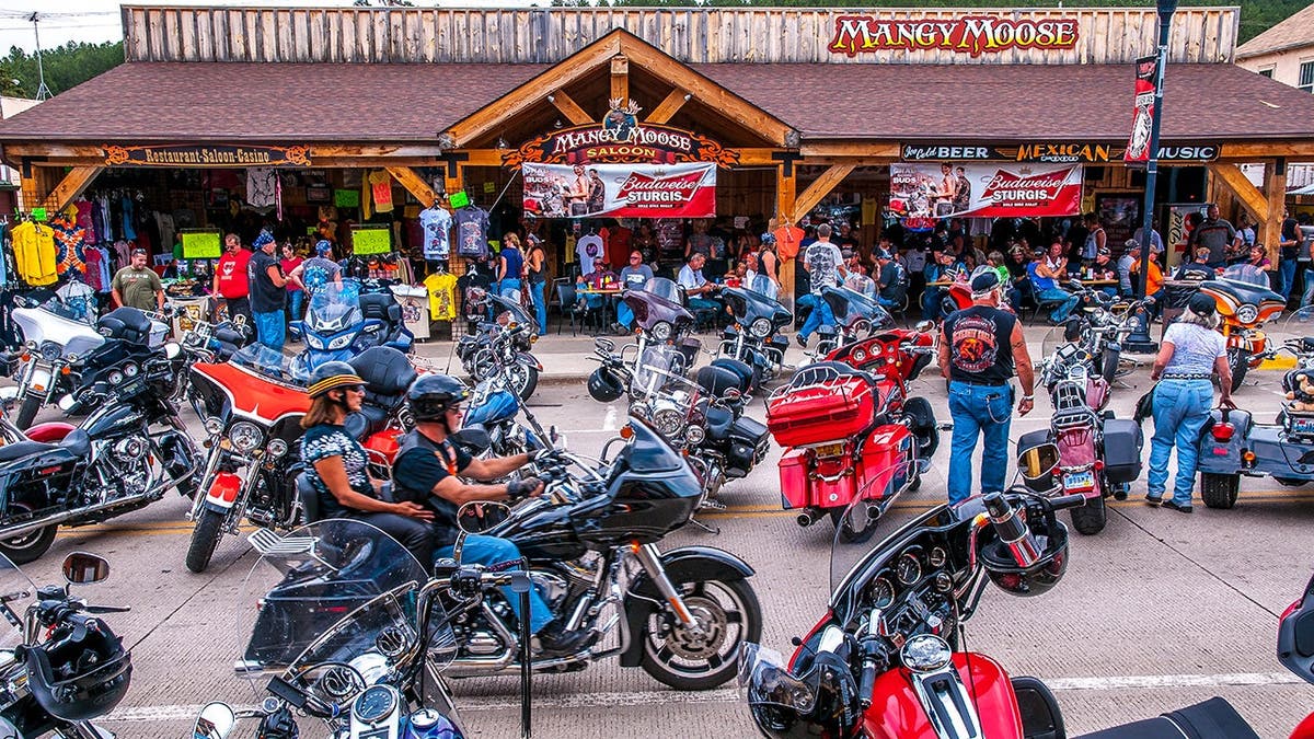 A group of motorcycle riders hang out in Sturgis, South Dakota.