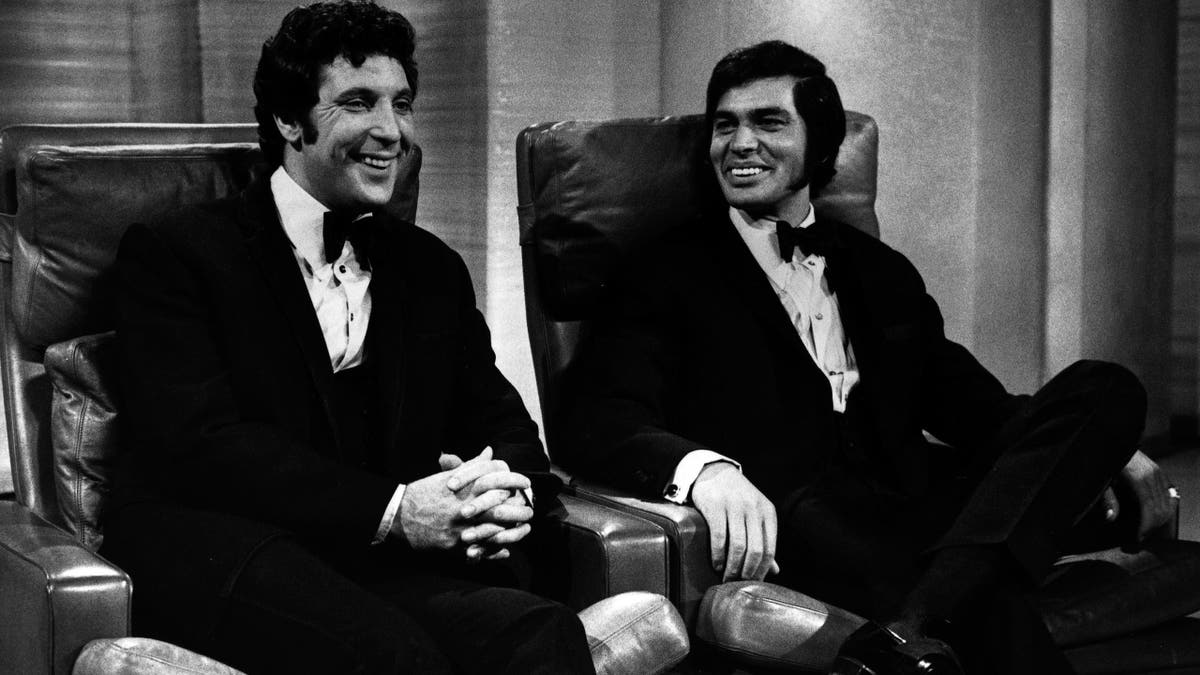 Tom Jones and Engelbert Humperdinck sit next to each other.