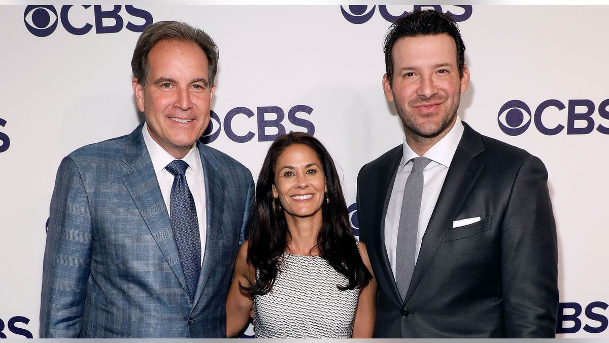 Jim Nantz, Tracy Wolfson and Tony Romo pose